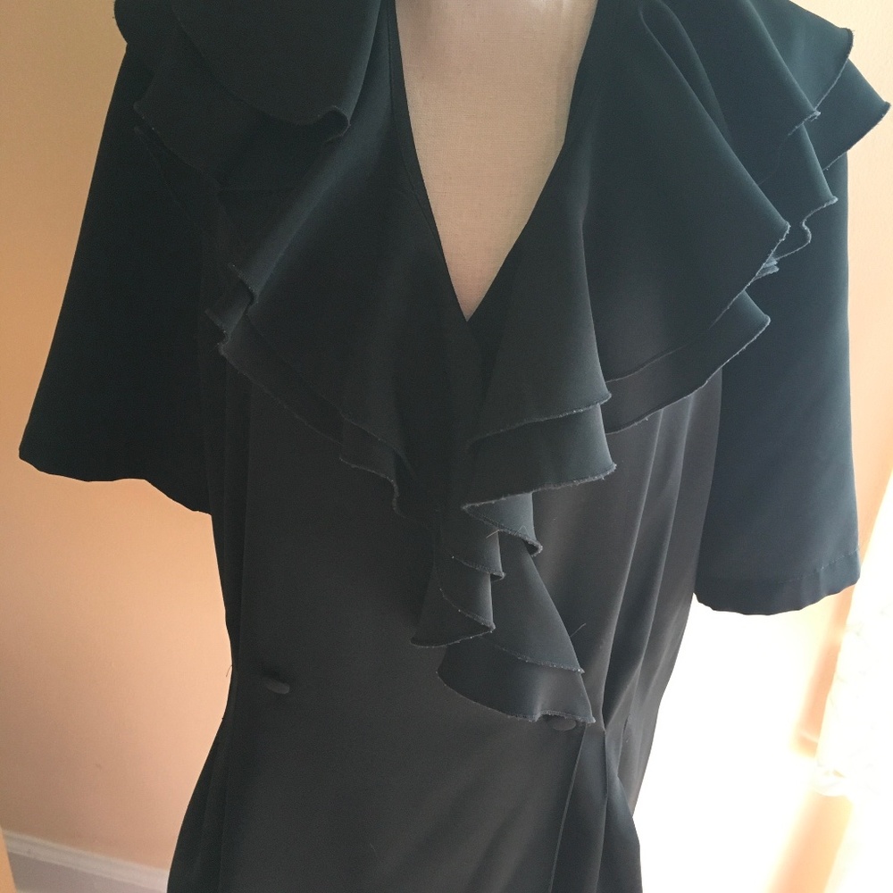 Black, Polly blouse. Double breasted button front. Ruffled collar.